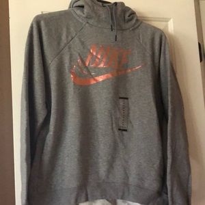 NWT Nike grey hoodie with rose gold logo. Size medium.